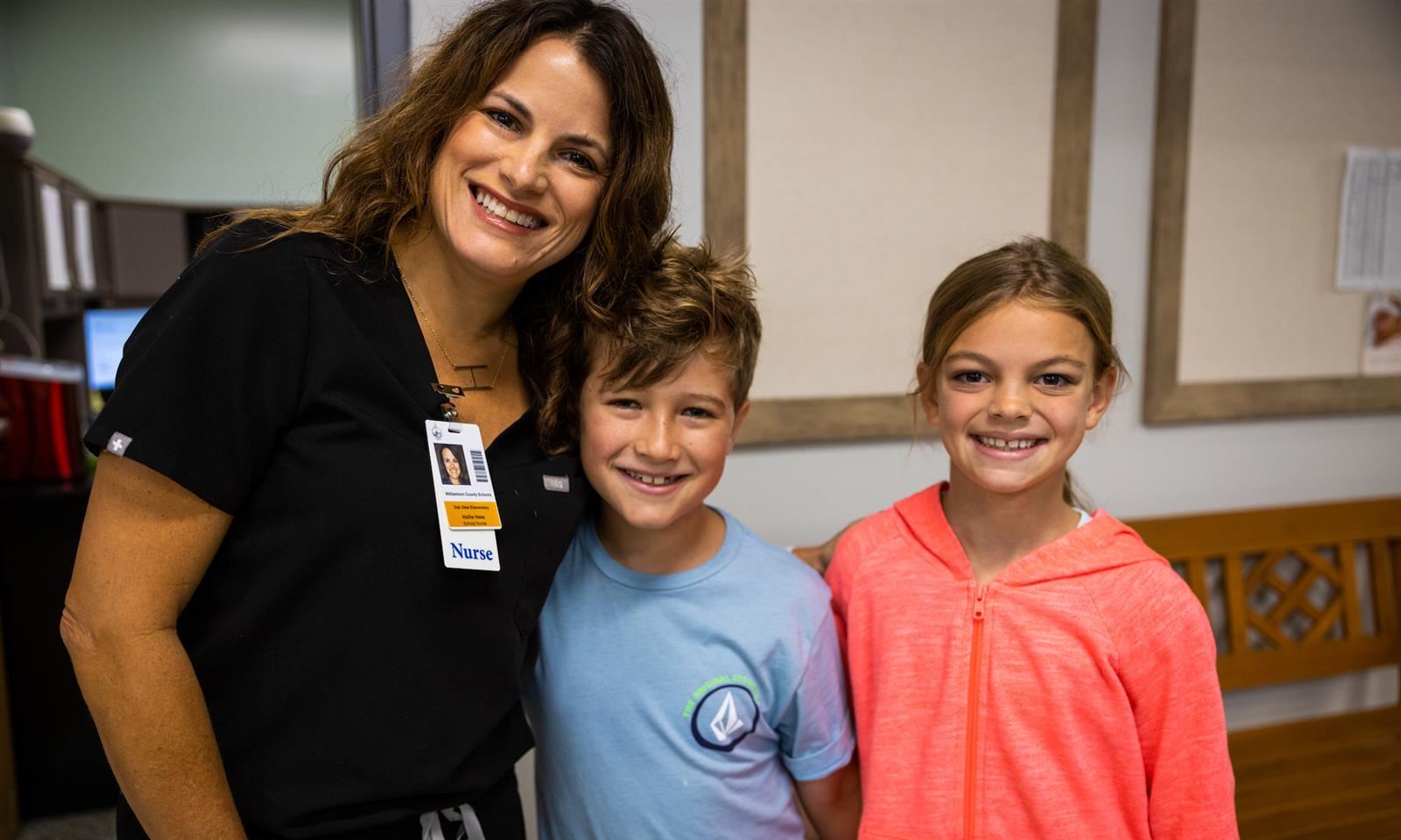 Two students and a school nurse